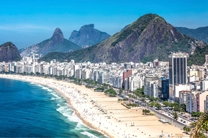 The white sands of Copacabana Beach stretch before Rio de Janeiro